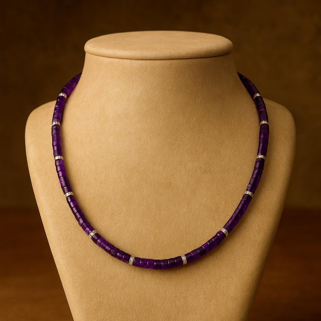 Amethyst bead necklace on a jewelry display.