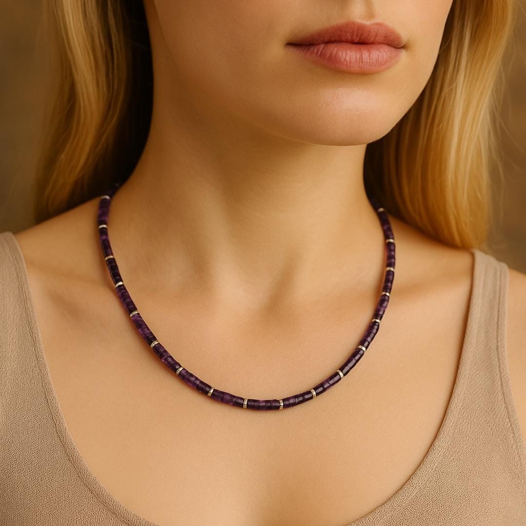 Amethyst bead necklace worn around the neck.