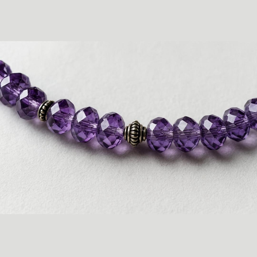 Close-up of amethyst bead necklace.