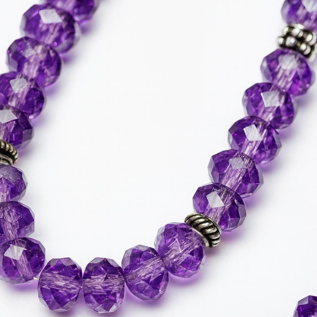 Close-up of amethyst bead necklace.