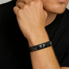Obsidian Core Bracelet featuring 12x12mm pyramid-cut Silver Obsidian stones resting on a dark volcanic surface. Handmade luxury gemstone jewelry for grounding and energetic protection. A bold talisman bracelet for men and women seeking clarity and inner strength. Natural crystal bracelet, spiritual gift, protective stone jewelry.