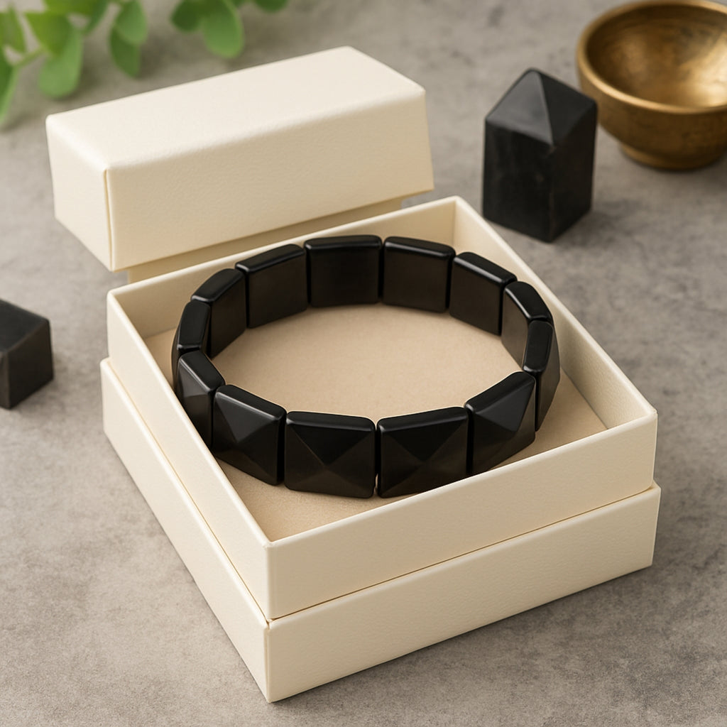 Obsidian Core Bracelet on a clean white background — 12x12mm pyramid-cut Silver Obsidian stones on a high-durability elastic band. Minimalist luxury crystal bracelet for grounding, clarity, and psychic protection. Handmade natural gemstone jewelry. Spiritual bracelet gift for men and women. Black obsidian talisman.