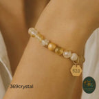 Hand holding the Citrine Abundance Bracelet against the sunlight. The translucent yellow citrine beads glow, representing the light of abundance. This 18K gold plated accessory is more than just jewelry; it is a 520 energy tool for shifting reality. The wealth bracelet encourages generosity and sharing good fortune. A perfect solar plexus healing stone. This handmade piece makes a stunning unique gift for anniversaries or holidays. Wear it to align with the frequency of prosperity.