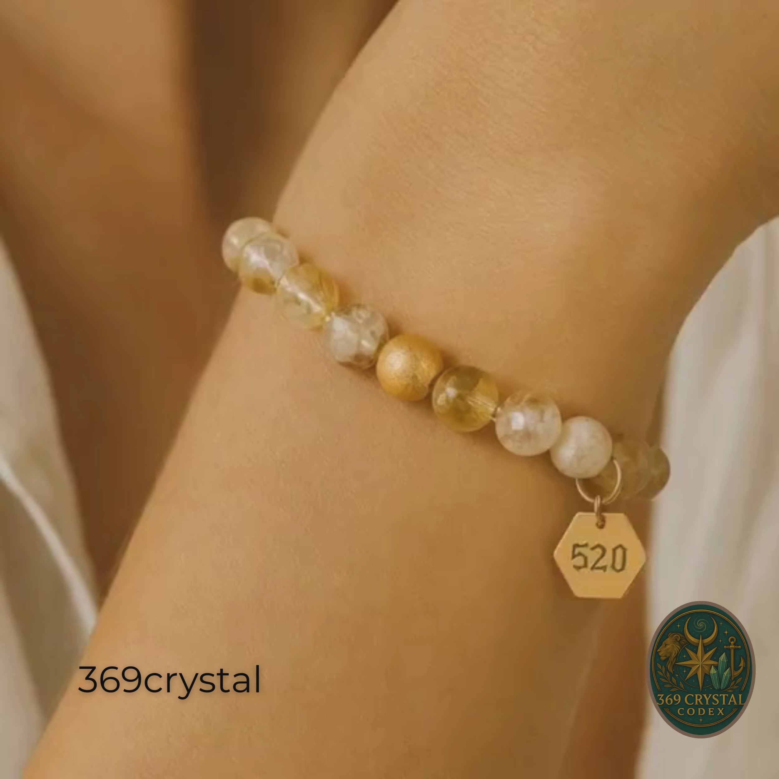 Hand holding the Citrine Abundance Bracelet against the sunlight. The translucent yellow citrine beads glow, representing the light of abundance. This 18K gold plated accessory is more than just jewelry; it is a 520 energy tool for shifting reality. The wealth bracelet encourages generosity and sharing good fortune. A perfect solar plexus healing stone. This handmade piece makes a stunning unique gift for anniversaries or holidays. Wear it to align with the frequency of prosperity.